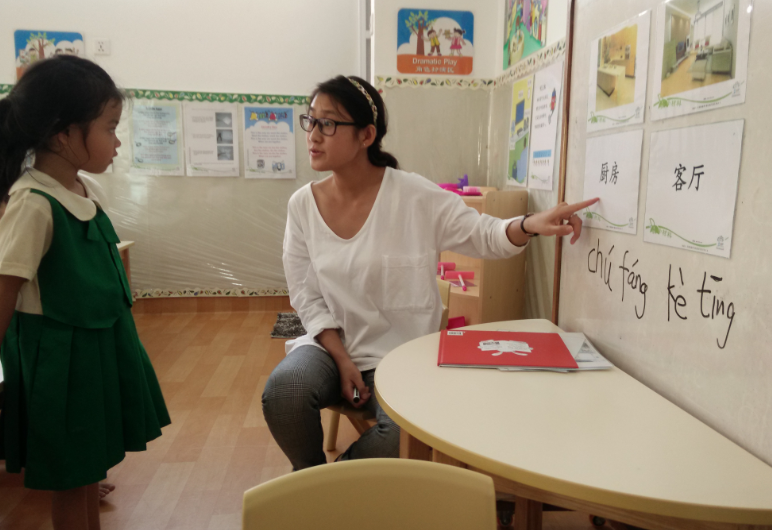 Our Chinese teacher from China, Ms Wang , having a Chinese lesson with the K1 class.