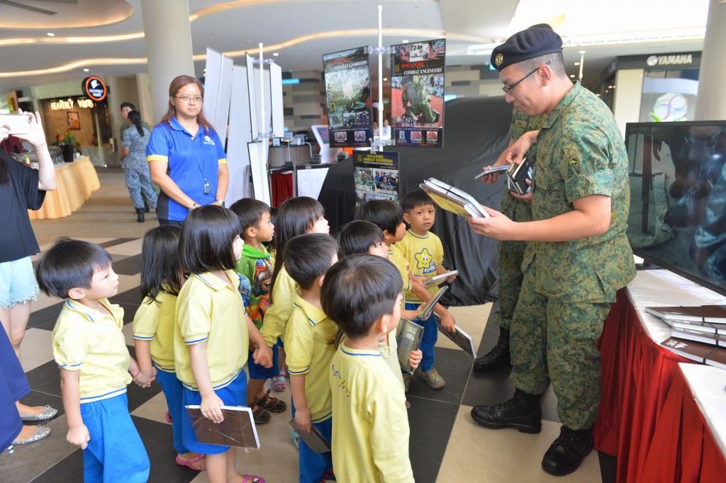 Army regulars sharing about SAF Day with NurtureStars children on SAF Day Combined