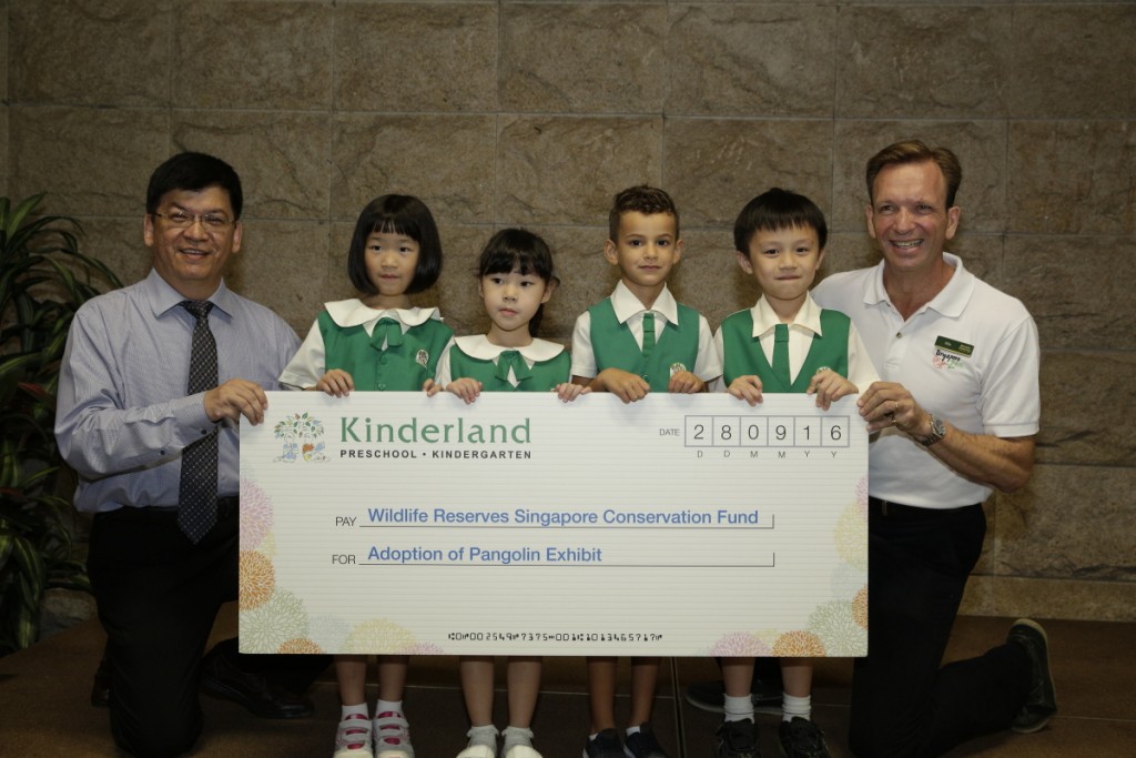 Our Little Pangolin Ambassadors at the Cheque Presentation Ceremony with Mr Seet Lee Kiang, General Manager of Kinderland Educare Services and Mr Mike Barclay, CEO of Wildlife Reserves Singapore.